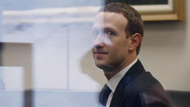 Facebook CEO Mark Zuckerberg walks