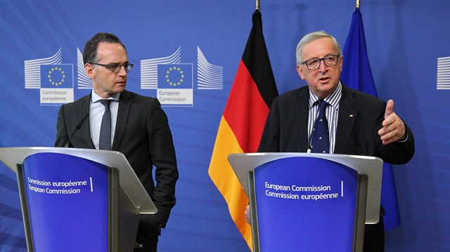German Foreign Minister Heiko Maas (L) and European Commission Chief Jean-Claude Juncker hold a joint press conference following their meeting in Brussels, Belgium on April 13, 2018.