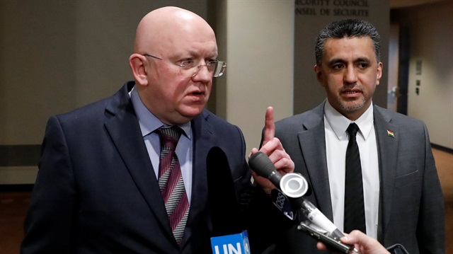 Russian Ambassador to the United Nations Vassily Nebenzia (L) 