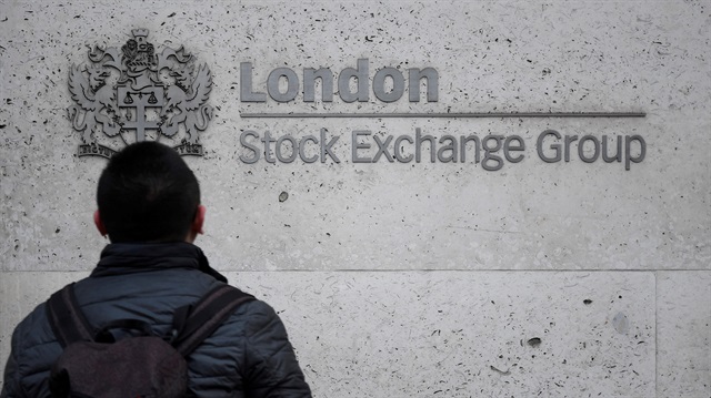 File Photo: People walk past the London Stock Exchange Group offices in the City of London, Britain, December 29, 2017. R