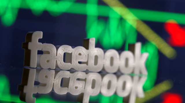 File Photo: A 3D-printed Facebook logo is seen in front of displayed stock graph in this illustration photo, March 20, 2018.