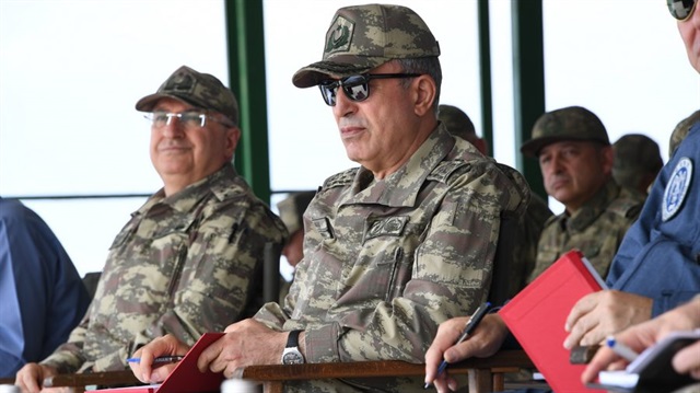 Turkey's Chief of General Staff Gen. Hulusi Akar (C).