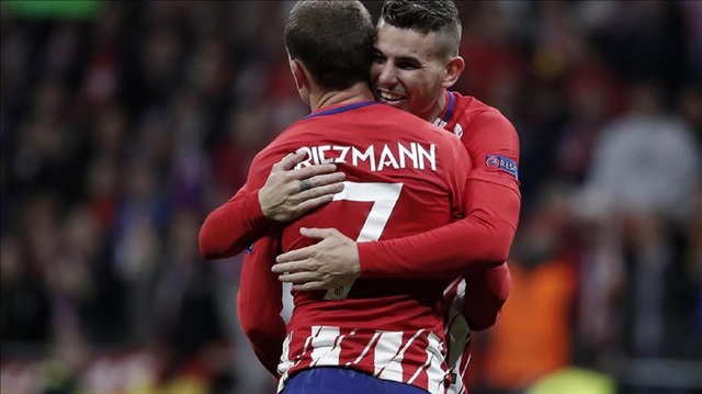 Footballers of Atletico Madrid celebrate their victory at the end of the UEFA Europa League semi final return match between Atletico Madrid and Arsenal at Wanda Metropolitano Stadium on May 03, 2018 in Madrid, Spain.