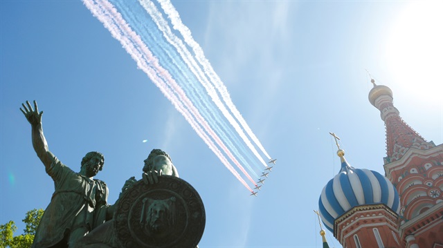 Russian Air Force Su-25 jets smoke in the colours of the national flag