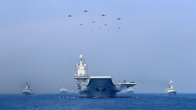 Warships and fighter jets of Chinese People's Liberation Army (PLA) Navy