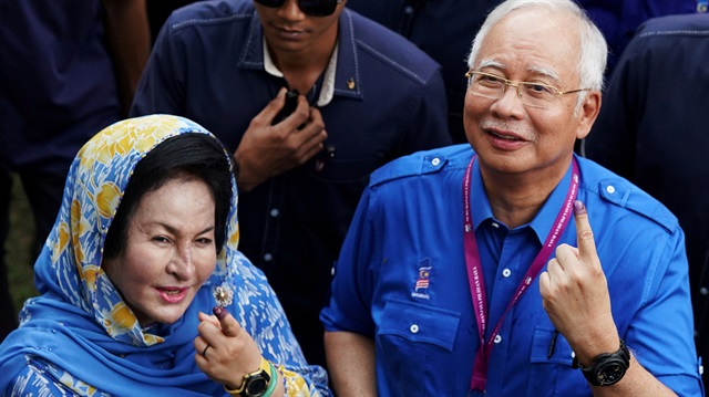 File Photo: Malaysia's former Prime Minister Najib Razak of Barisan Nasional (National Front) and his wife Rosmah Mansor show their ink-stained fingers after voting in Malaysia's general election in Pekan, Pahang, Malaysia, May 9, 2018. 