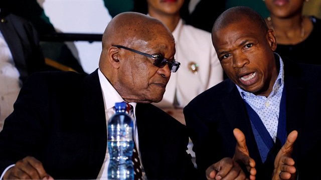 File Photo: South Africa's former President Jacob Zuma chats with Premier of North West Province Supra Mahumapelo before addressing the National Youth Day commemoration