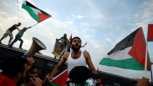 Filistinliler, ABD'nin Kudüs kararı sonrası sokaklara dökülerek, büyük protesto gösterileri düzenledi. (Fotoğraf: Reuters)