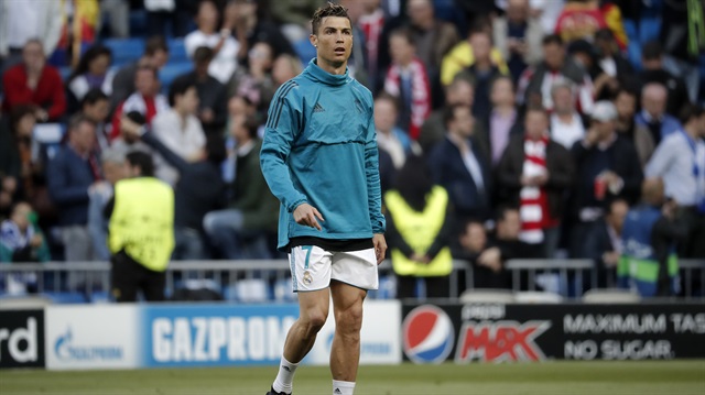 Cristiano Ronaldo (R) of Real Madrid warms up ahead of Champions League semi final return match between Real Madrid and FC Bayern Munich at the Santiago Bernabeu Stadium in Madrid, Spain on May 1, 2018.