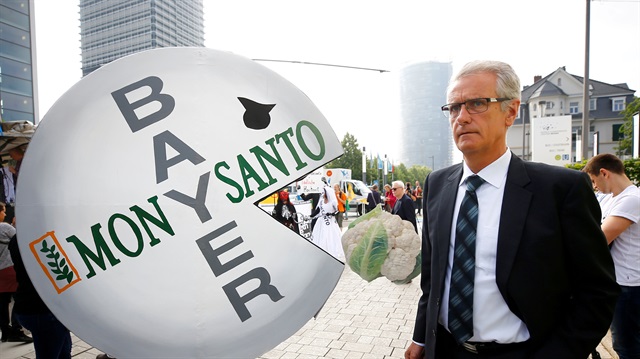 A Bayer's shareholder arrives at the annual general shareholders meeting