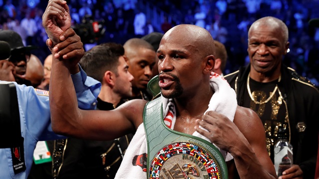 File Photo: Floyd Mayweather Jr. celebrates with the belt after winning the fight against Conor McGregor (not shown) in Las Vegas, Neveda, U.S., August 26, 2017. 