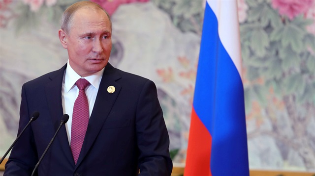 Russian President Vladimir Putin attends a news conference 