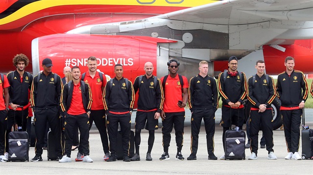 Belgian national soccer team players pose on the tarmac before their departure to Russia, at Brussels' national airport in Zaventem, Belgium June 13, 2018.