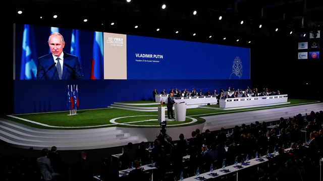 Participants listen to Russian President Vladimir Putin during the 68th FIFA Congress in Moscow, Russia June 13, 2018.