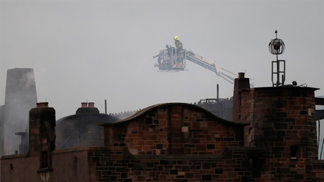Firefighters attend to a blaze at the Mackintosh Building at the Glasgow School of Art, which is the second time in four years, Glasgow, Scotland, Britain June 16, 2018. 