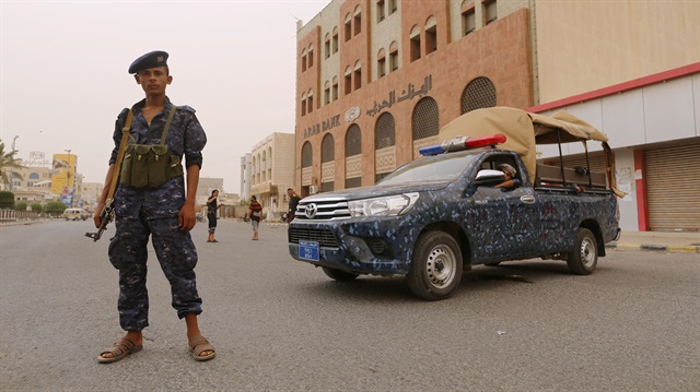 A pro-Houthi police trooper stands past a patrol vehicle in the Red Sea port city of Hodeidah, Yemen June 14, 2018. 