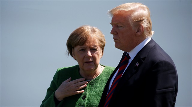  Germany's Chancellor Angela Merkel talks with U.S. President Donald Trump