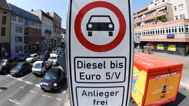 A truck passes by a traffic sign, which bans diesel cars at the Max-Brauer Allee in downtown Hamburg, Germany, May 31, 2018. 