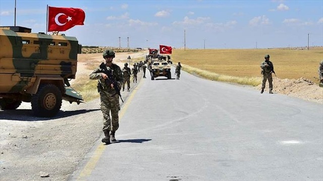 Armoured vehicles and soldiers of Turkish Armed Forces start to patrol between northern Syrian city of Manbij and Turkey's Operation Euphrates Shield area on June 18, 2018. Turkish and U.S. troops in line with a previously agreed roadmap for eliminating terrorists and stabilizing the area.