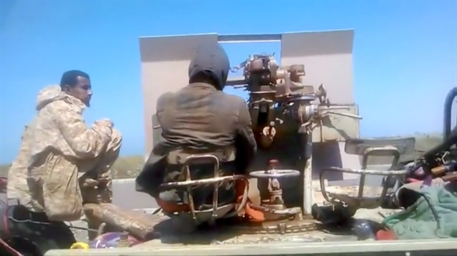 Members of UAE-backed fighters, Yemeni Resistance Giants' Brigade sit with the gun at the back of truck, near airport on the outskirts of Hodeidah, Yemen, June 19, 2018 in this still image taken from video. 