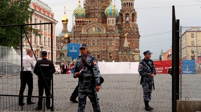 Russian police patrol at the fan zone in front of the Church of the Savior on Blood 