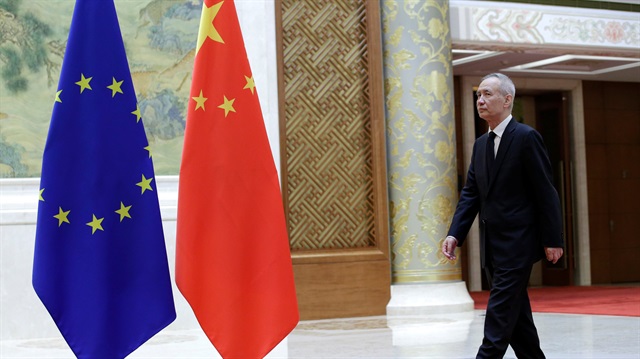 Chinese Vice Premier Liu He walks near EU and China flags ahead of the EU-China High-level Economic Dialogue at Diaoyutai State Guesthouse in Beijing, China June 25, 2018. 