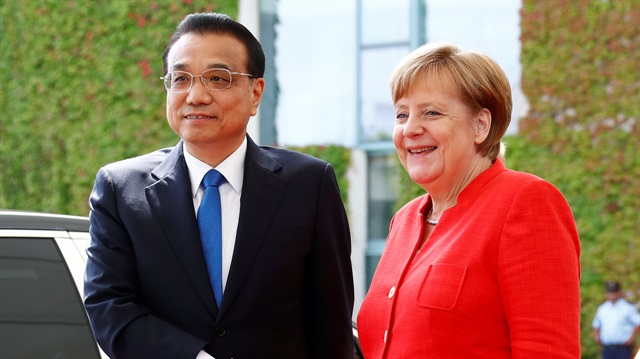 German Chancellor Angela Merkel and Chinese Prime Minister Li Keqiang shake hands at the chancellery in Berlin, Germany.