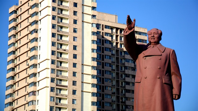 File Photo: A statue of former Chinese chairman Mao Zedong is seen in front of a residential building in Dandong New Zone, Liaoning province, China.