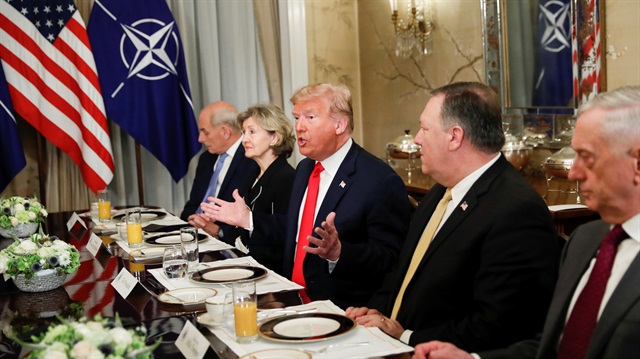 U.S. President Donald Trump gestures as he and U.S. Secretary of Defence James Mattis, U.S. Secretary of State Mike Pompeo attend a bilateral breakfast with NATO Secretary General Jens Stoltenberg ahead of the NATO Summit in Brussels, Belgium July 11, 2018.