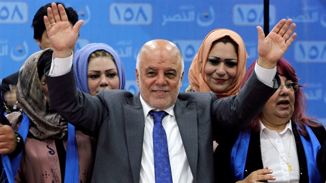 FILE PHOTO: Iraqi Prime Minister Haidar al-Abadi attends the election campaign, along with his supporters in Kirkuk, Iraq.