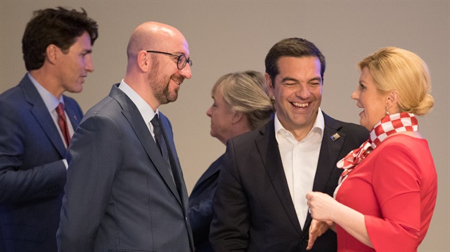 Prime Minister of Canada Justin Trudeau, Belgian Prime Minister Charles Michel, Prime Minister of Greece Alexis Tsipras and Croatia President Kolinda Grabar-Kitarovic are seen prior a working dinner at the Parc du Cinquantenaire during the NATO Summit in Brussels, Belgium.