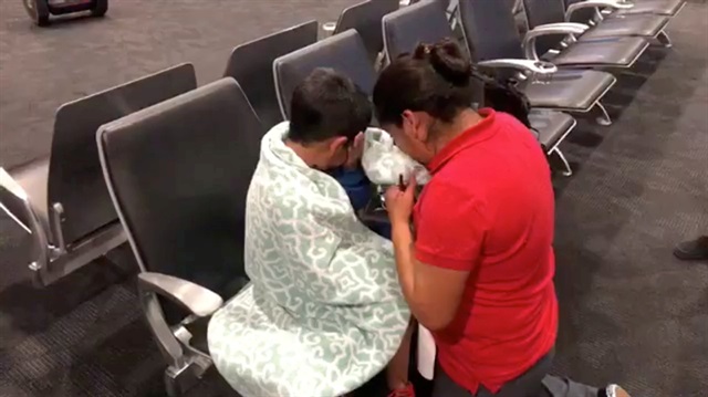 A migrant mother and her son are reunited after immigrant separation, in Baltimore-Washington International Airport, Maryland, U.S., June 22, 2018 in this still image taken from a video obtained from social media.