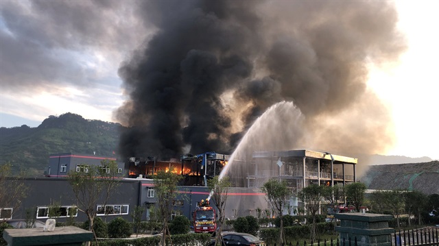 Rescue workers try to put out a fire after an explosion at a chemical plant inside an industrial park in Yibin, Sichuan province, China.