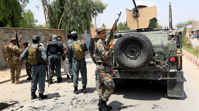 File Photo: Afghan policemen leave the site of an attack in Jalalabad city, Afghanistan.