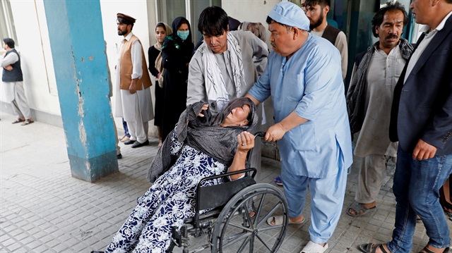 An Afghan woman mourns at the hospital after a blast in Kabul, Afghanistan.