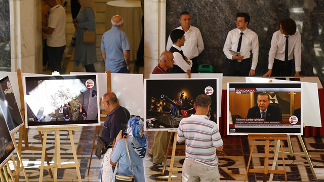 People visit the photograph exhibition opened within the July 15 Democracy and National Unity Day to mark July 15 defeated coup's 2nd anniversary at Grand National Assembly of Turkey (TBMM) in Ankara