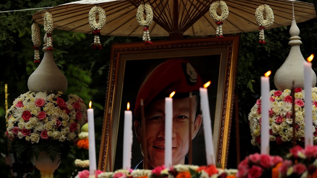 Portrait of a former Thai navy diver, Samarn Kunan, who died during the rescue mission for the 12 boys of the "Wild Boars" soccer team and their coach, near the Tham Luang cave complex, is seen in the funeral, in the northern province of Chiang Rai, Thailand.