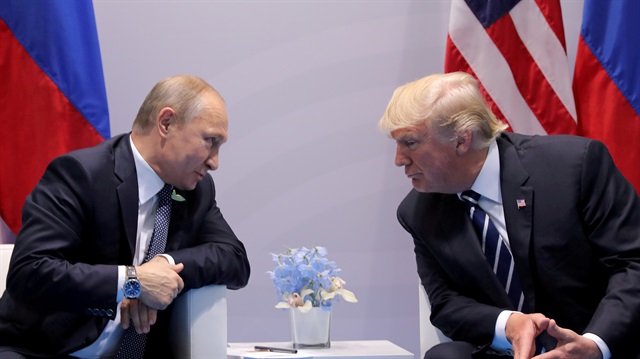File photo: Russia's President Vladimir Putin talks to U.S. President Donald Trump 