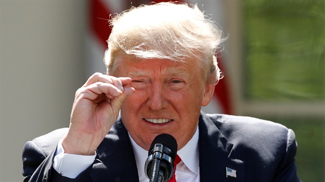 FILE PHOTO: U.S. President Donald Trump refers to amounts of temperature change as he announces his decision that the United States will withdraw from the landmark Paris Climate Agreement, at the White House in Washington, U.S.