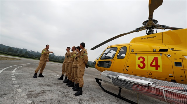 Members of GIPS, elite firefighters, speak during a training session at their base near Pombal, Portugal