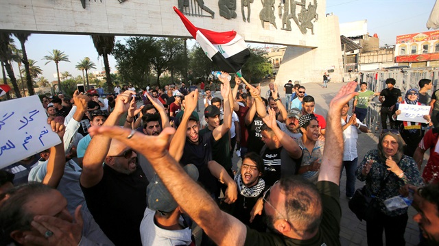 raqi shout slogans during a protest in Baghdad, Iraq 