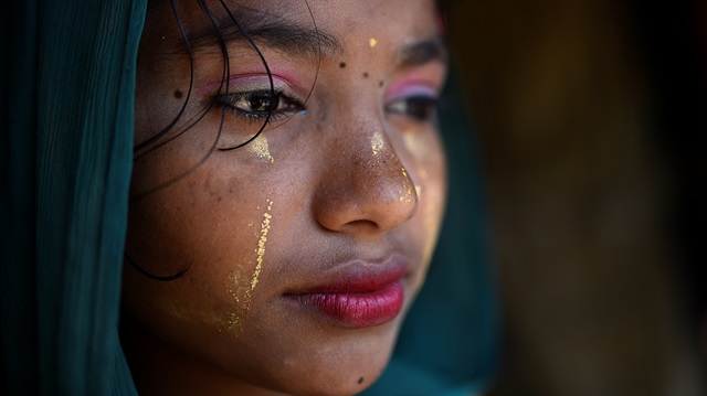 File photo: A Rohingya refugee girl poses for a photograph