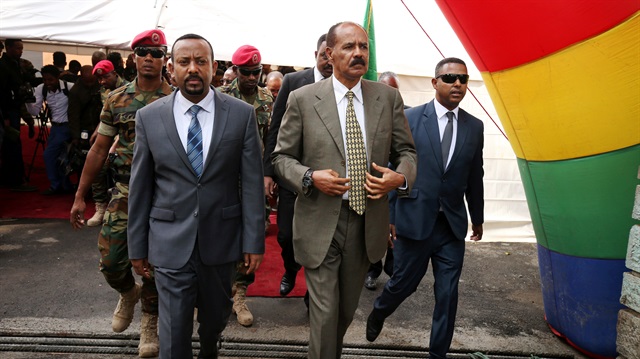Eritrea's President Isaias Afwerki and Ethiopia's Prime Minister, Abiy Ahmed arrive for an inauguration ceremony marking the reopening of the Eritrean embassy in Addis Ababa, Ethiopia.
