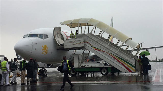 Ethiopian Airlines staff prepare their plane as they resume flights to Eritrea's capital Asmara at the Bole International Airport in Addis Ababa, Ethiopia.