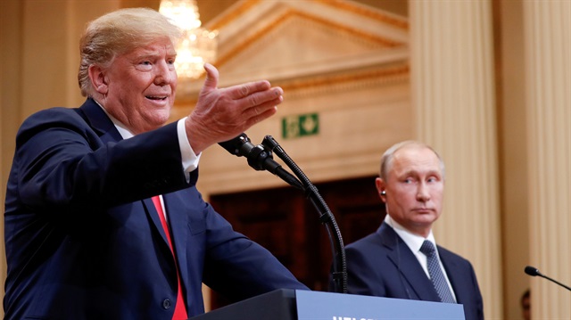 File photo: U.S. President Donald Trump gestures during a joint news conference with Russia's President Vladimir Putin after their meeting in Helsinki