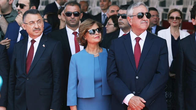 Turkish Cypriot leader Mustafa Akinci and Turkish Vice President Fuat Oktay (L) are seen during a parade to mark the 1974 Turkish invasion of Cyprus in response to a briefly lived Greek-inspired coup, in the Turkish Cypriot northern part of the divided city of Nicosia, Cyprus.
