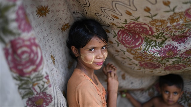 File photo: A Rohingya refugee girl poses for a photograph 