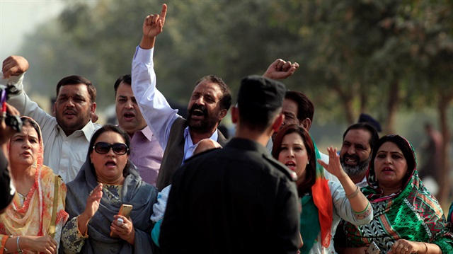 Supporters from the ruling Pakistan Muslim League-Nawaz (PML-N) chant slogans outside National Accountability Bureau (NAB) court in Islamabad, Pakistan.