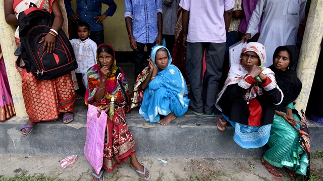 Villagers wait outside the National Register of Citizens (NRC) centre to get their documents verified by government officials, at Mayong Village in Morigaon district, in the northeastern state of Assam, India