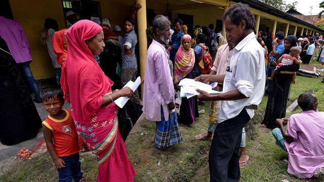 Villagers wait outside the National Register of Citizens (NRC) centre to get their documents verified by government officials, at Mayong Village in Morigaon district, in the northeastern state of Assam, India.